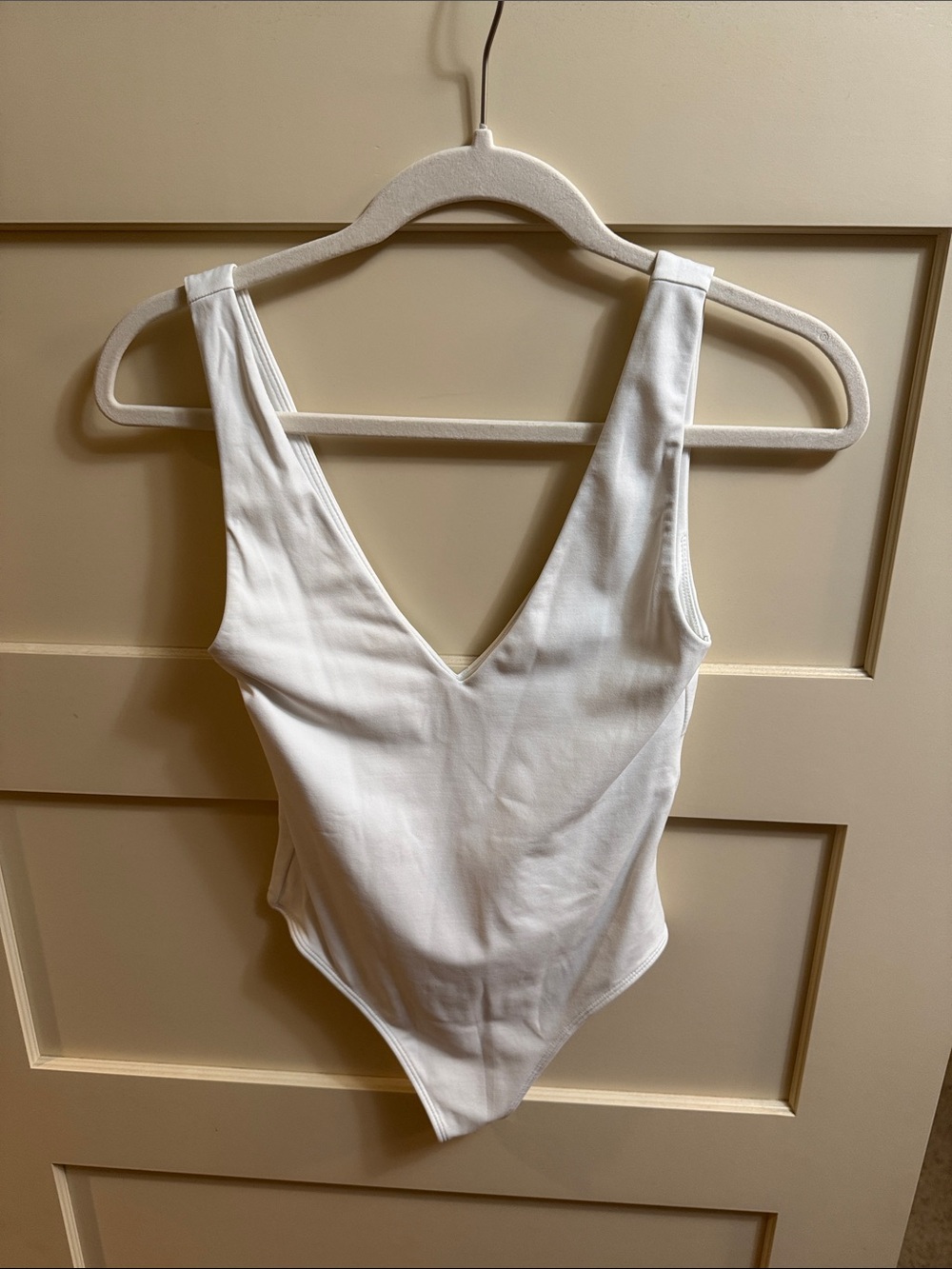 Babaton White V-Neck Ribbed Bodysuit